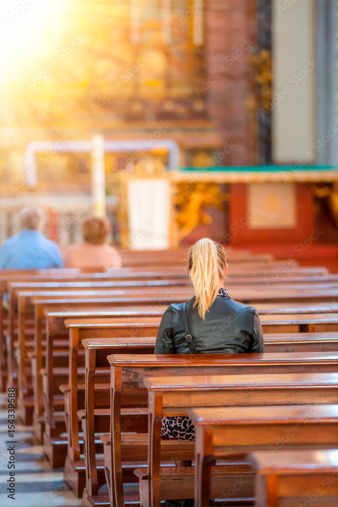 People praying in a church People praying in a church