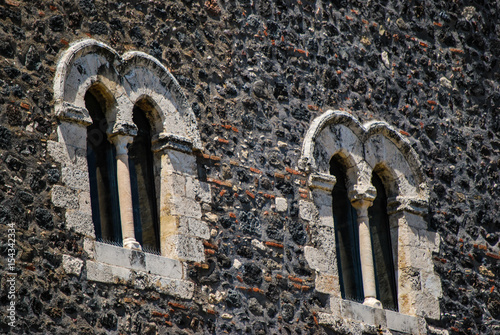 Detail of windows on the main side of the medieval castle in Paterno. Sicily