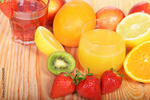 Orange juice in a glass with strawberries