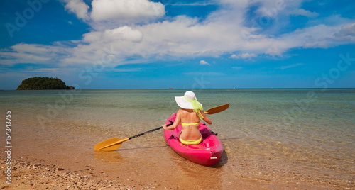 Fototapeta Naklejka Na Ścianę i Meble -  Thailand. Woman sea, bikini, hat, tan, kayak. Libong