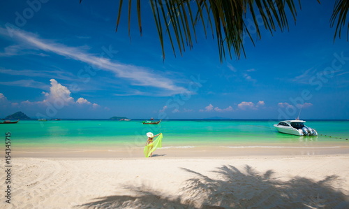 Thailand. Woman sea, bikini, hat, white beach, palm, yacht. Phiphi