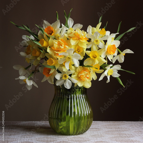 Bouquet of daffodils in a glass vase.