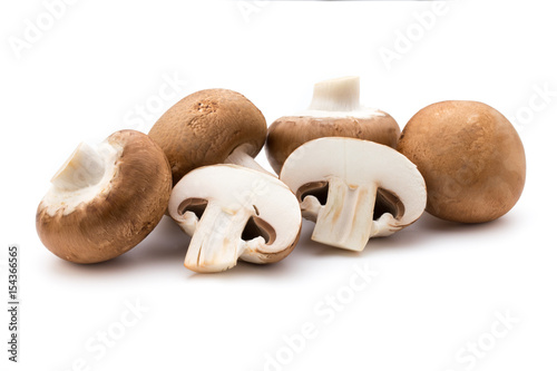 Fresh champignon mushrooms isolated on white.