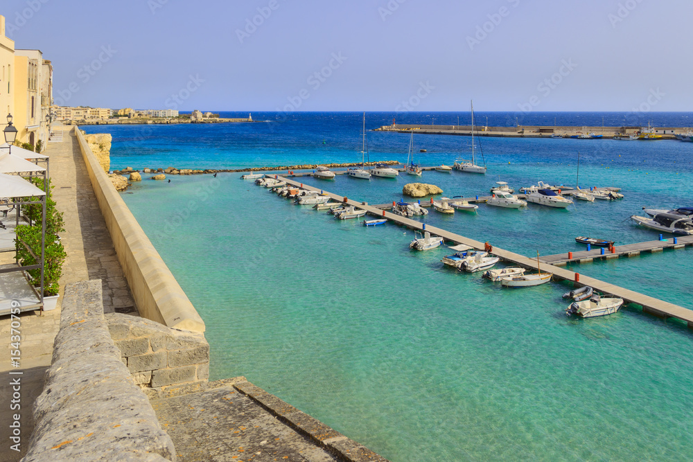 Salento coast: panorama of the port of Otranto.Italy(Apulia).View from the old town surrounded by crystal clear sea.
