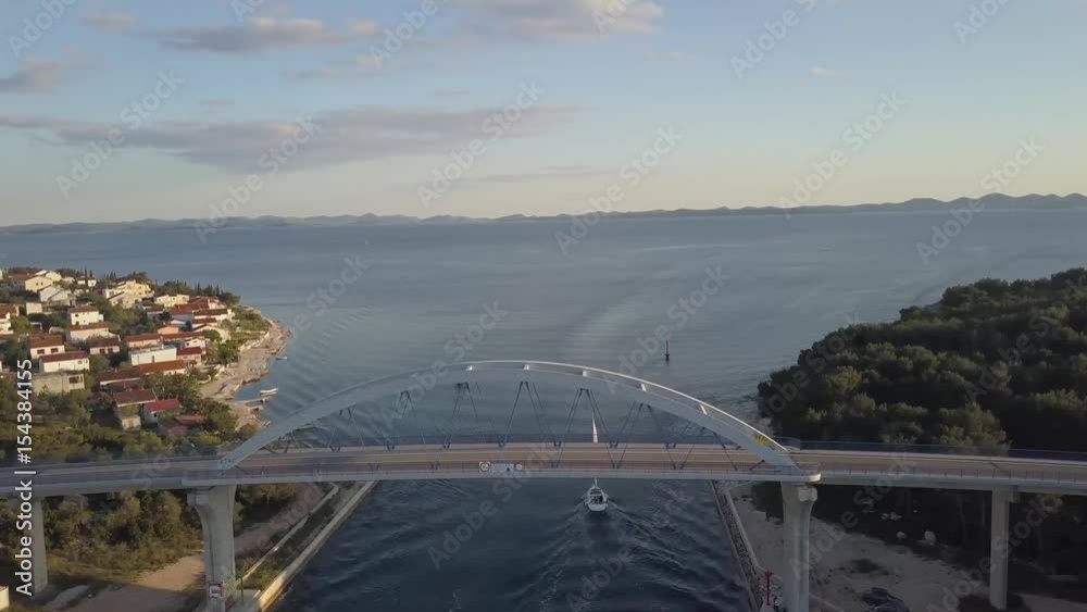 Aerial panorama view with bridge and sea around islands. Beautiful landscape surrounded with blue sea with bridge between. Location near Zadar in Croatia, Pasman, Ugljan. Aerial panorama view with bridge and sea around islands. Beautiful landscape surrounded with blue sea with bridge between. Location near Zadar in Croatia, Pasman, Ugljan.