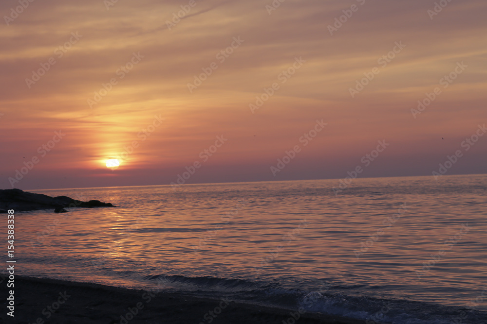 Colorful sky and the sea reflected in sunset. sunset on the sea with the sky in the clouds Turkey beach