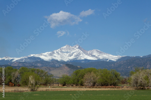 Snow capped Longs Peak and Mt Meeker on a spring or summer day