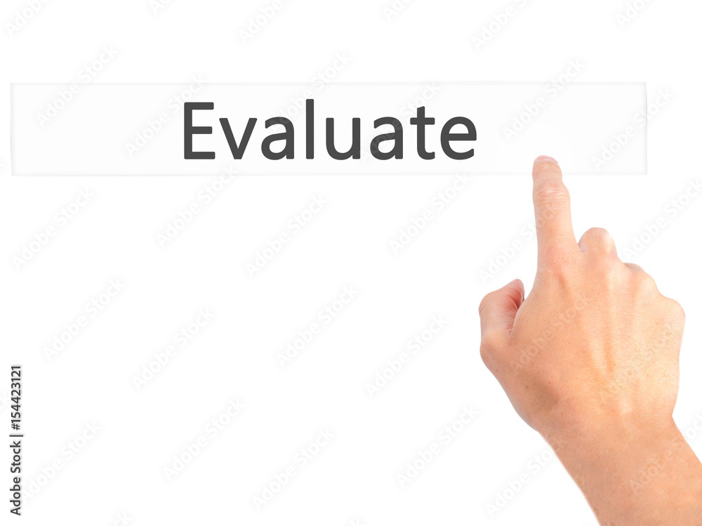 Evaluate - Hand pressing a button on blurred background concept on visual screen. Evaluate - Hand pressing a button on blurred background concept on visual screen.