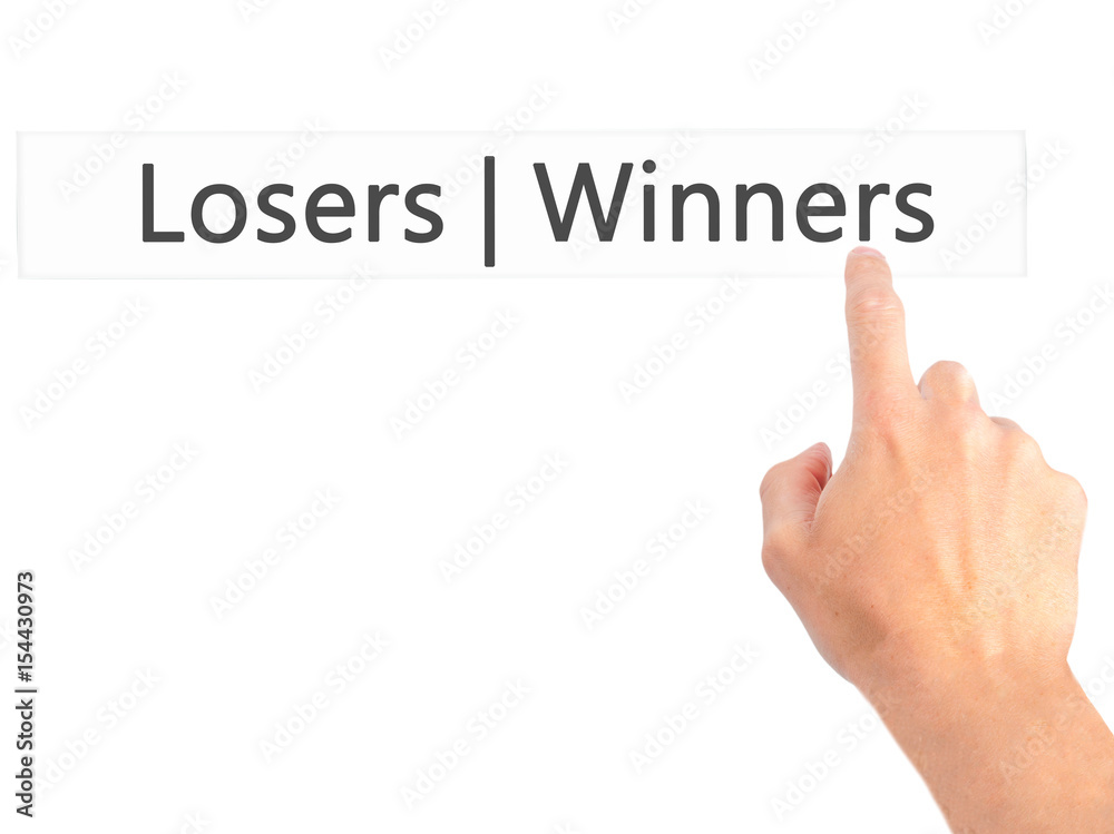 Winners Losers - Hand pressing a button on blurred background concept on visual screen. Winners Losers - Hand pressing a button on blurred background concept on visual screen.