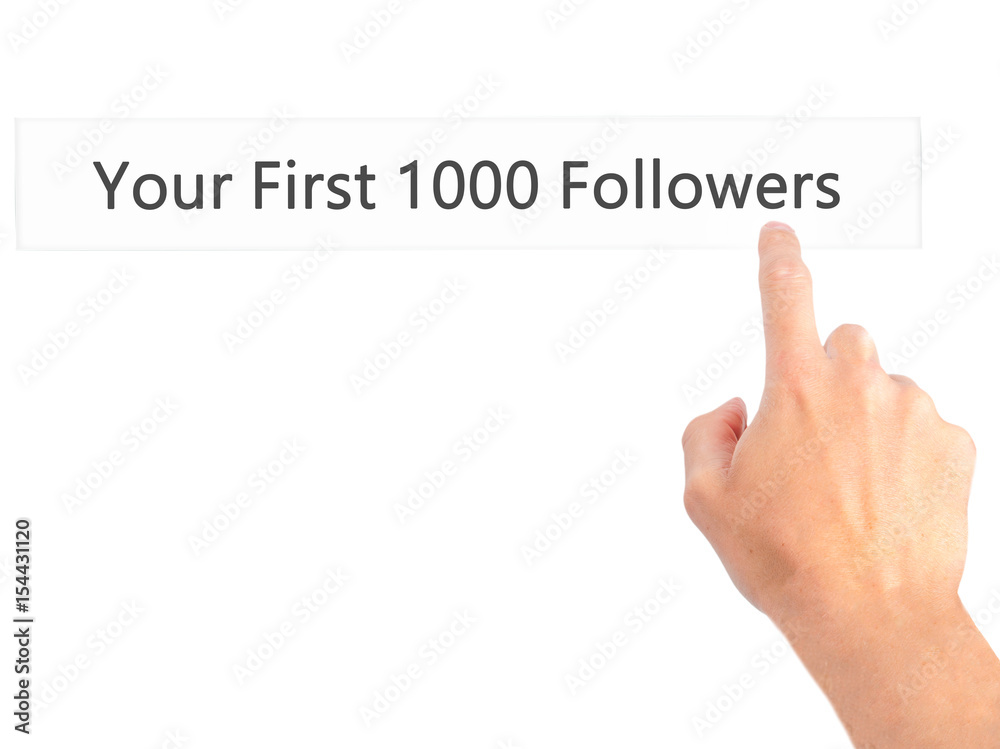 Your First 1000 Followers - Hand pressing a button on blurred background concept on visual screen. Your First 1000 Followers - Hand pressing a button on blurred background concept on visual screen.