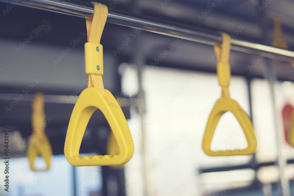Handle on ceiling of bus train, MRT, prevent toppling.underground railway system or metro, ,selective focus,vintage color
