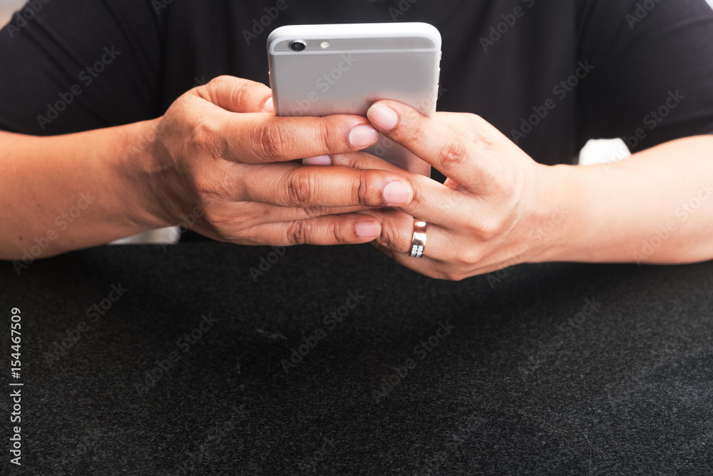 woman holding her smart phone two hand and using it to connecting. concepts for social, business, online shopping, payment, banking, sharing. woman holding her smart phone two hand and using it to connecting. concepts for social, business, online shopping, payment, banking, sharing.
