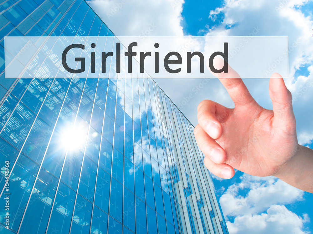 Girlfriend - Hand pressing a button on blurred background concept on visual screen. Girlfriend - Hand pressing a button on blurred background concept on visual screen.