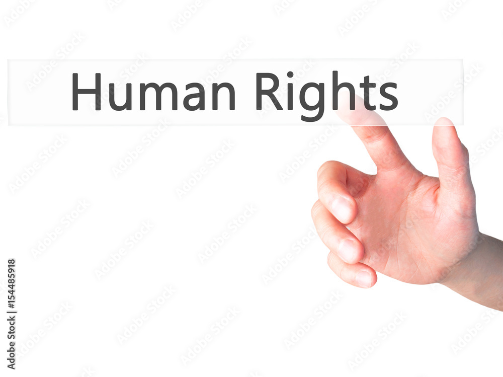 Human Rights - Hand pressing a button on blurred background concept on visual screen. Human Rights - Hand pressing a button on blurred background concept on visual screen.