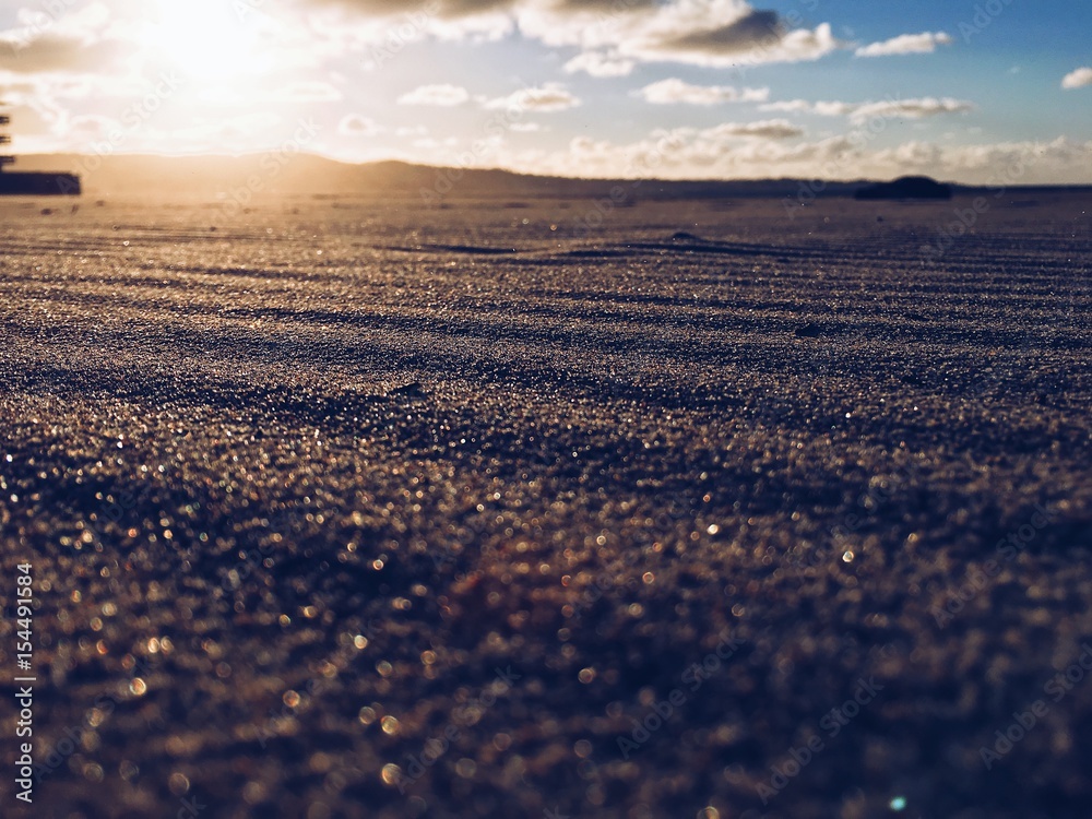 Glittering sand at sunset Glittering sand at sunset
