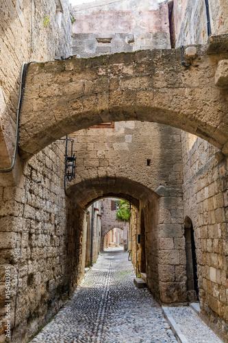 Charming narrow street in the old town of Rhodes  Rhodes island  Greece