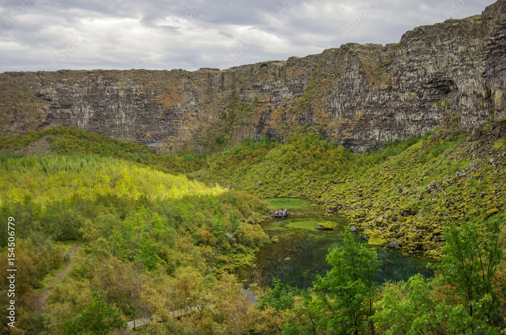 Asbyrgi canyon in Jokulsargljufur national park and green lake with refflection, Iceland