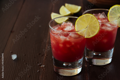 Red orange juice in glasses with ice