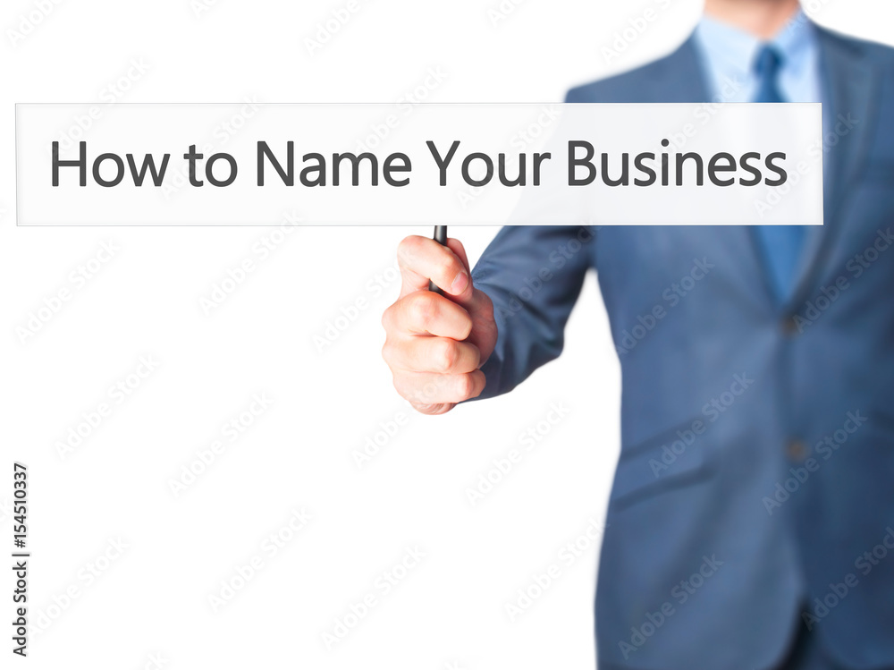 How to Name Your Business - Businessman hand holding sign How to Name Your Business - Businessman hand holding sign