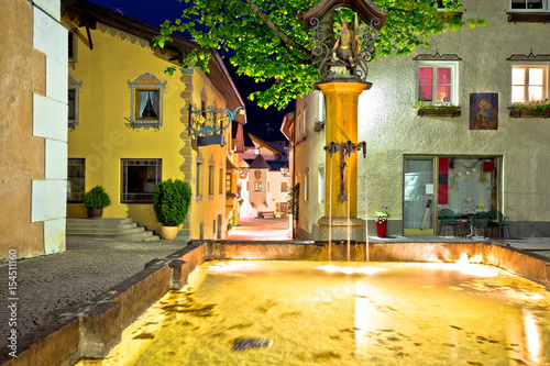 Town of Kastelruth fountain and street evening view photo