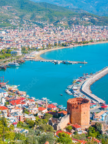 Landscape with marina and Kizil Kule tower in Alanya peninsula, Antalya district, Turkey