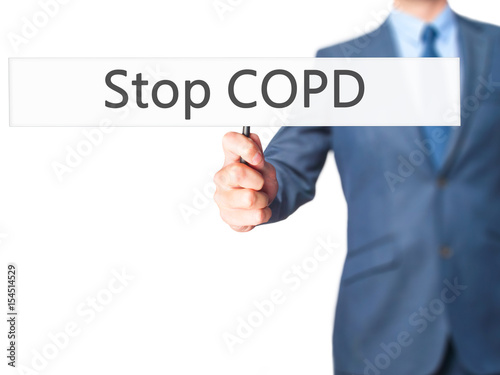 Stop COPD - Businessman hand holding sign