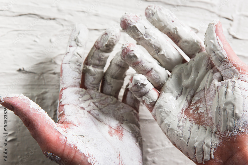 Obraz premium Hand White Plaster Closeup Repair Building Worker Dirty Stucco Construction Unrecognizable Concept