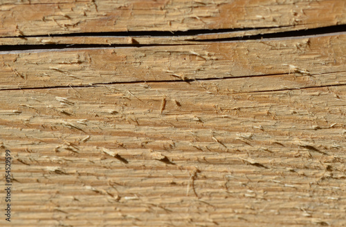Wooden background of boards illuminated by the sun