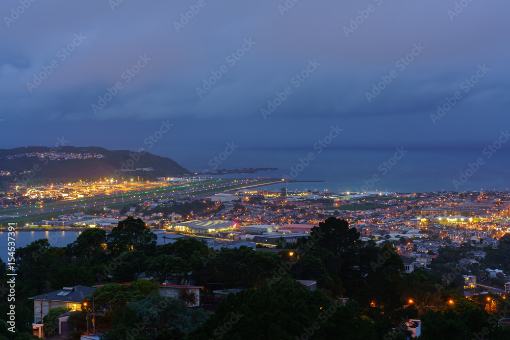 Scenery from Mount Victoria lookout at dusk viewing Wellington Airport's runway in Wellington , capital of New Zealand , North Island of New Zealand