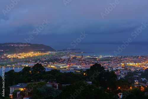 Scenery from Mount Victoria lookout at dusk viewing Wellington Airport's runway in Wellington , capital of New Zealand , North Island of New Zealand