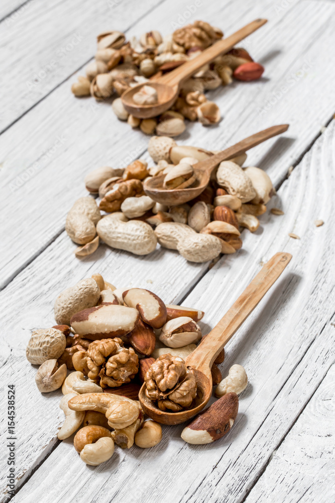 different nuts in plates different nuts in plates