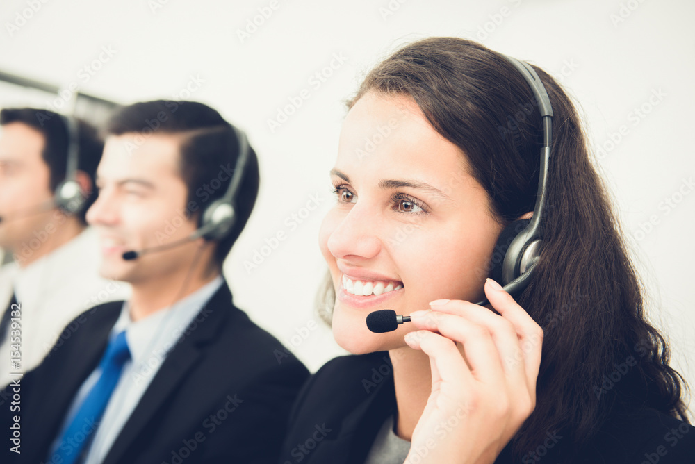 Beautiful smiling woman working in call center Beautiful smiling woman working in call center
