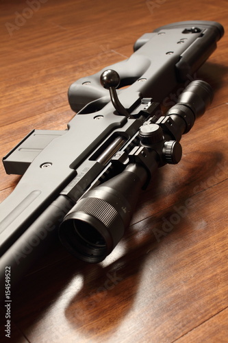 Sniper rifle on the wood floor