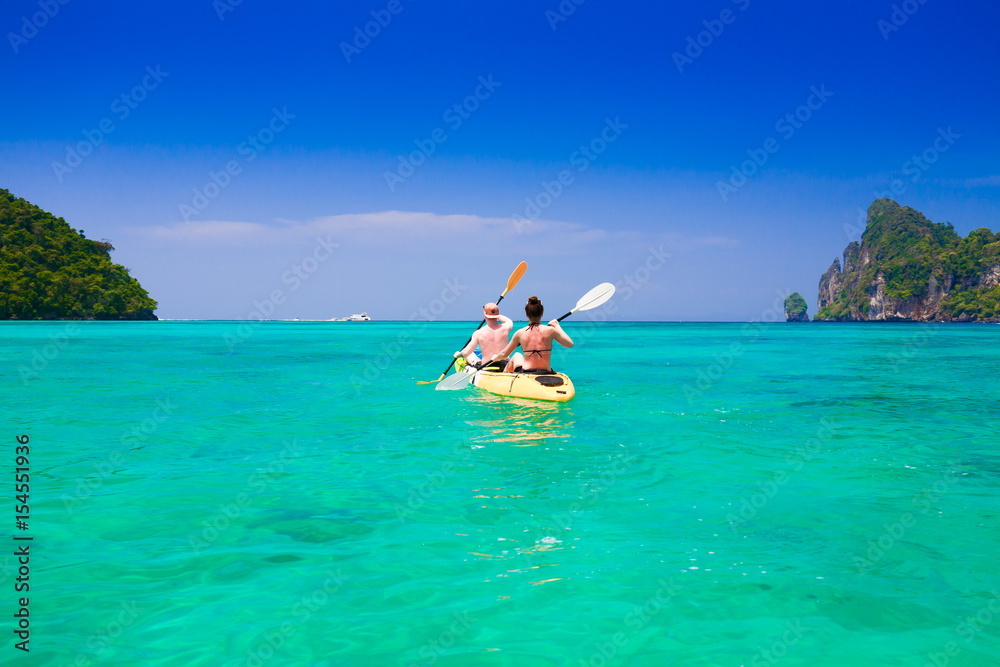 Thailand. Sea Phi Phi, woman and man kayaking Thailand. Sea Phi Phi, woman and man kayaking