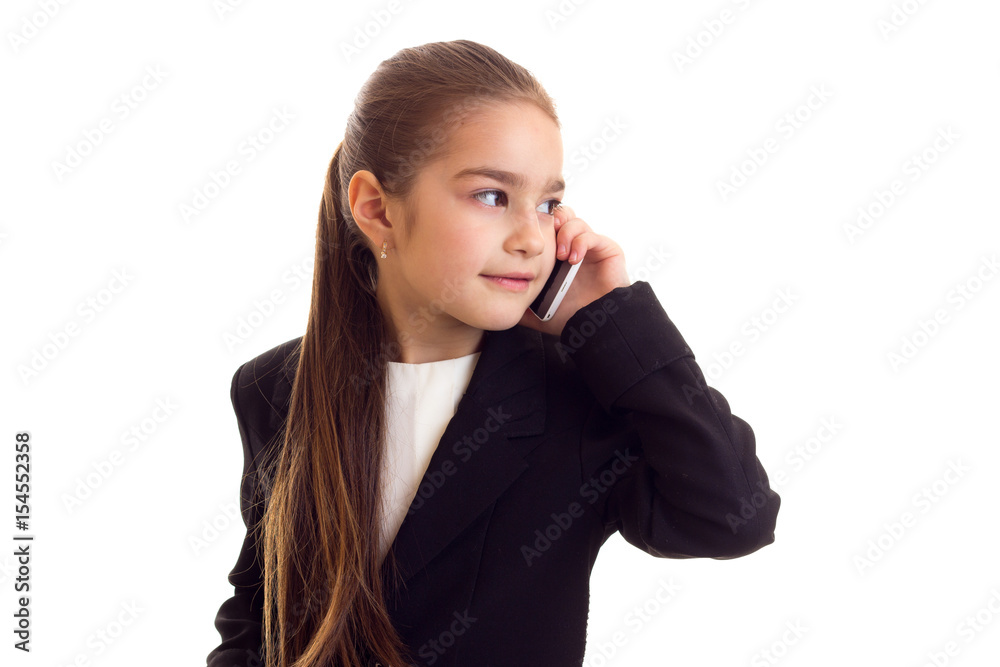 Little girl in black jacket talking on the phone Little girl in black jacket talking on the phone