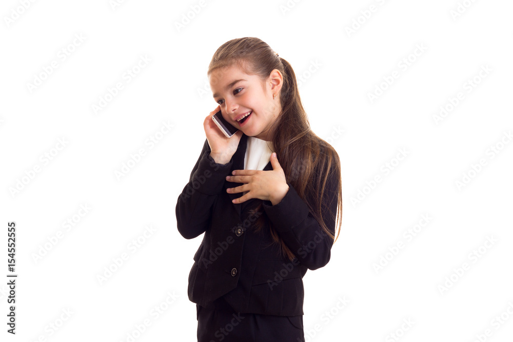 Little girl in black jacket talking on phone Little girl in black jacket talking on phone