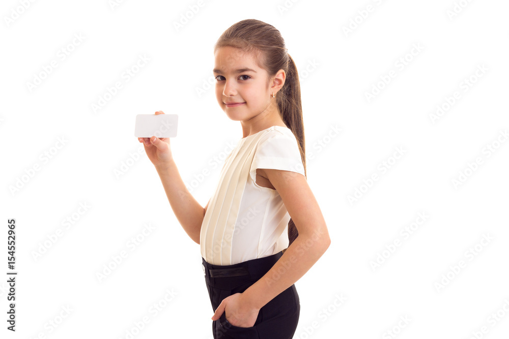 Little girl in white T-shirt holding white card Little girl in white T-shirt holding white card