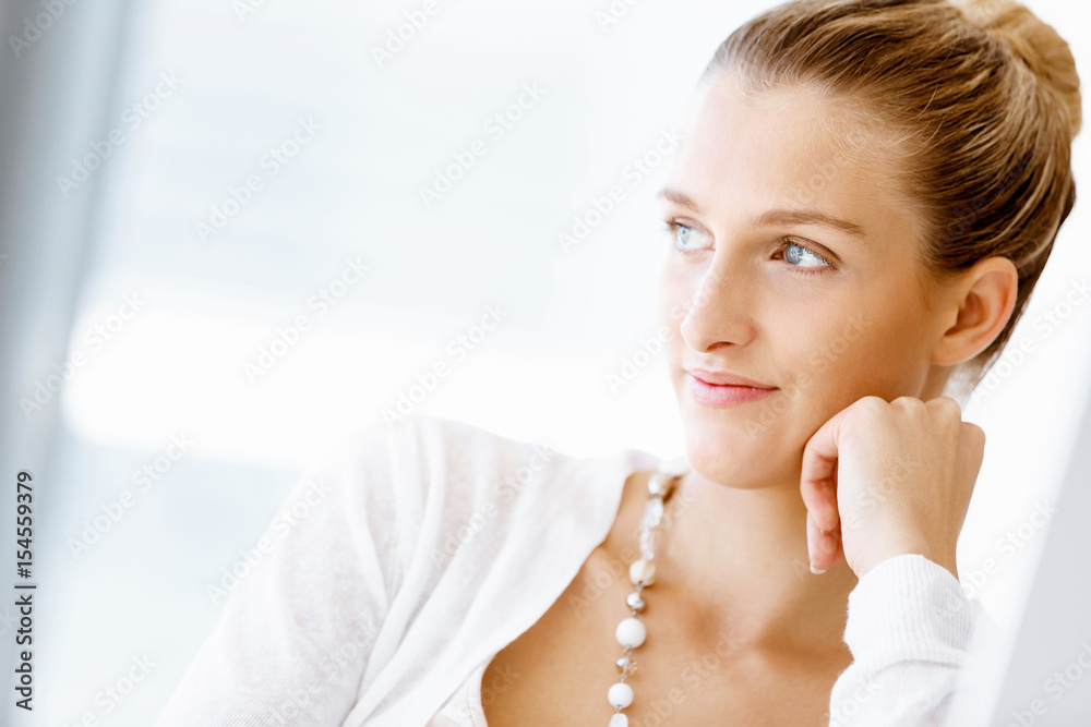 Attractive office worker sitting at desk Attractive office worker sitting at desk
