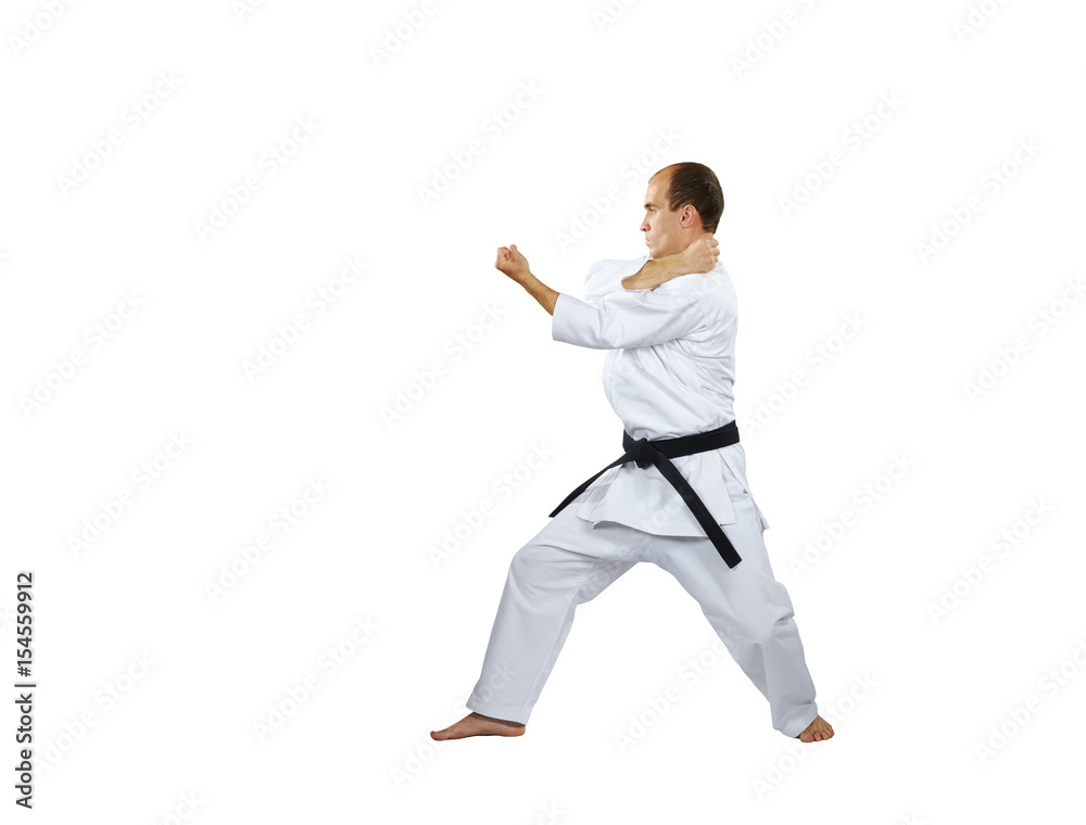 On a white background the athlete trains the blocks with his hands