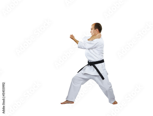 On a white background the athlete trains the blocks with his hands