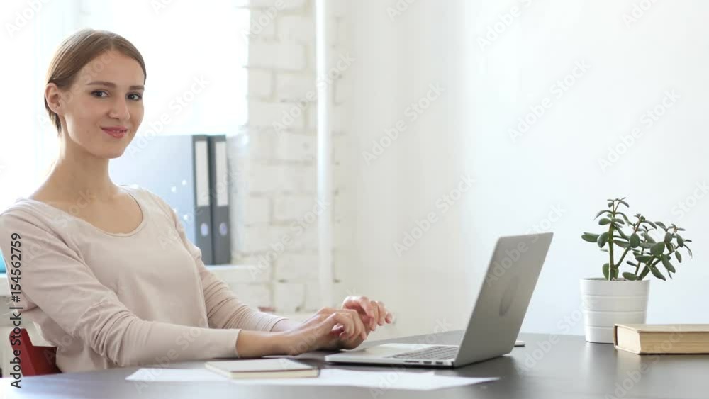 Smiling Creative Woman at Work in Loft Office Smiling Creative Woman at Work in Loft Office