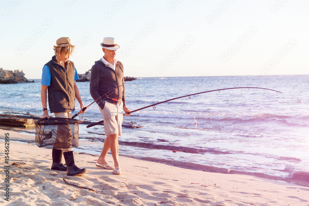 Senior man fishing with his grandson Senior man fishing with his grandson