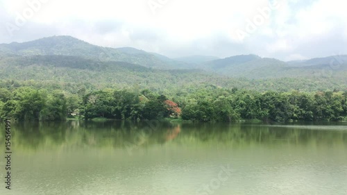 4K footage. mountain and forest lake with Clouds movement . Blue Sky	