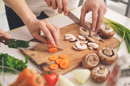 Family Cooking Meal Preparation Together Cutting Ingredients 