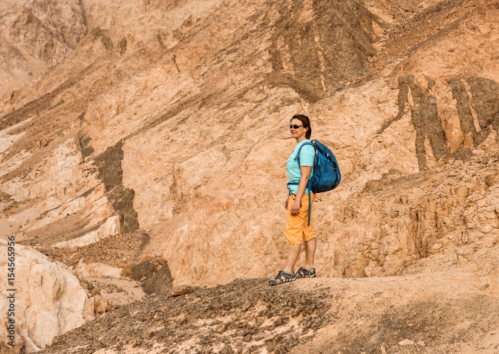 Woman Hiker with backpack enjoy view in desert