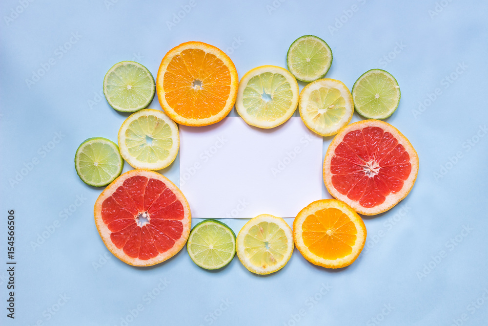 Citrus background with copy space. Citrus fruits on the blue background with copy space. Top view Citrus background with copy space. Citrus fruits on the blue background with copy space. Top view