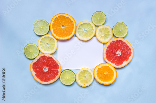 Citrus background with copy space. Citrus fruits on the blue background with copy space. Top view