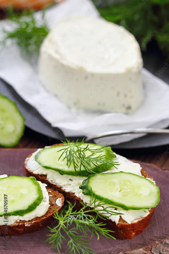 Sandwiches with soft cheese, cucumbers and greens Sandwiches with soft cheese, cucumbers and greens