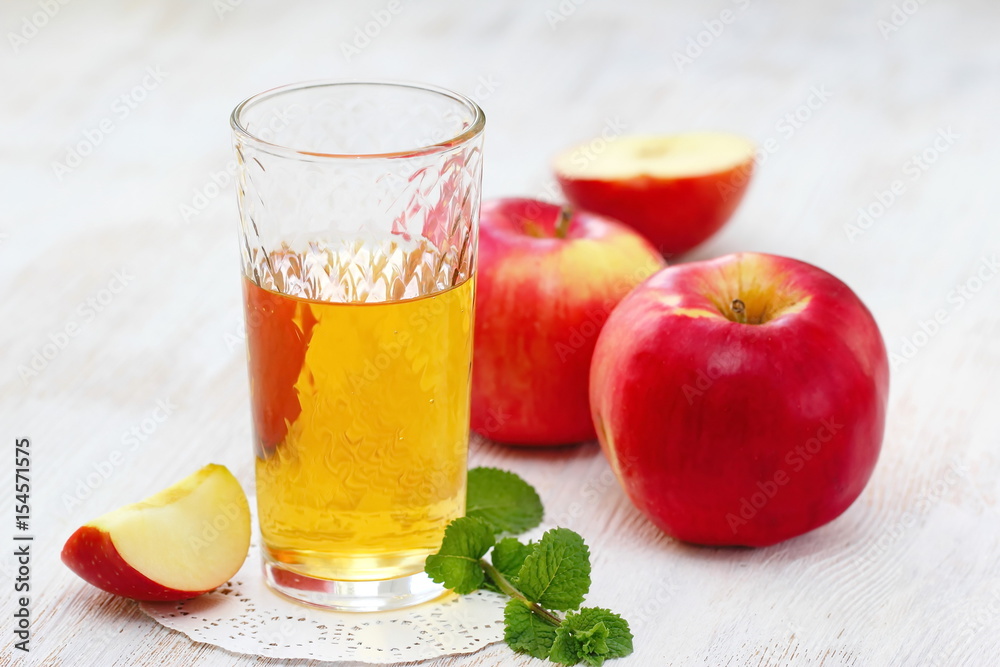 Apple juice and apples on the table Apple juice and apples on the table