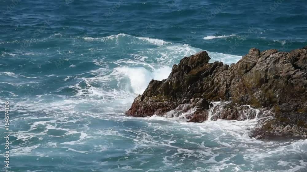 Sea waves breaking on rocky seashore Sea waves breaking on rocky seashore